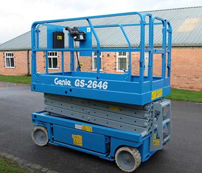 A 10m Electric ginelift scissor lift ready to be used outside a school
