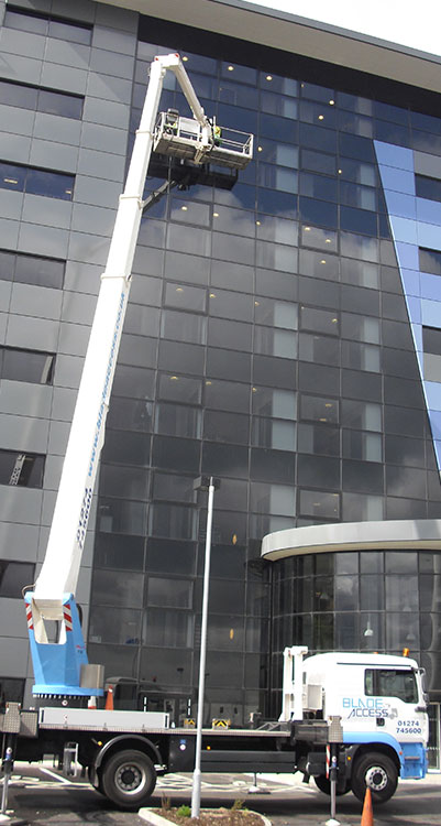 a 45m truck mounted platform being used for window cleaning